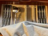 a silver spoon and spoon rest in a drawer