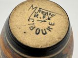 a close up of a vase with writing on it