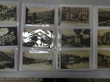 a display of old black and white photographs on the wall