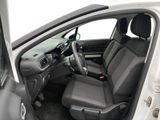 the interior of a car with the door open and the driver ' s seat down