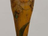 a vase that is sitting on a wooden table