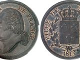 a close up of a coin with a crown on it