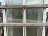 a wooden pallet with a glass window on top of it
