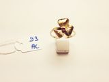 a gold ring with a flower on it and a price tag next to it