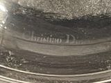 a black and white photo of a bowl with dirt on it