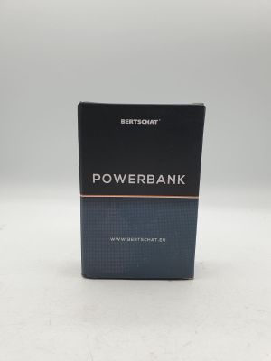 une boîte contenant une batterie externe posée sur une surface blanche