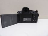 a camera that is sitting on a table next to a mirror