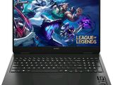 the laptop is open with a league of legends logo on the screen
