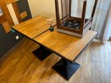 a wooden table with a glass case on top of it