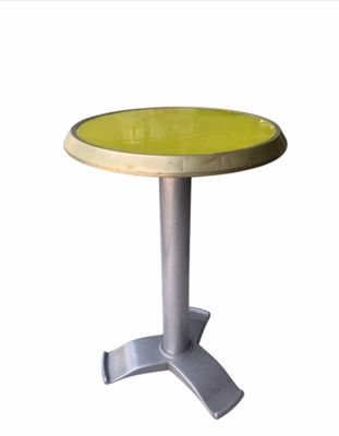 table with a yellow top and a silver base