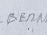 a fire hydrant that is next to a wall with writing on it