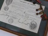 a picture of a document with a picture of a medal on it