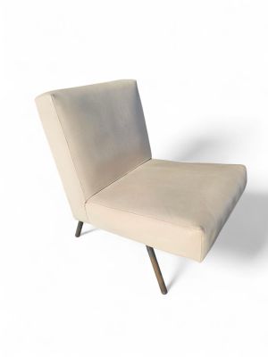 an upholstered chair with a wooden legs and a beige upholstered seat