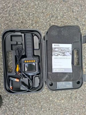 a black case that has a radio and other items in it