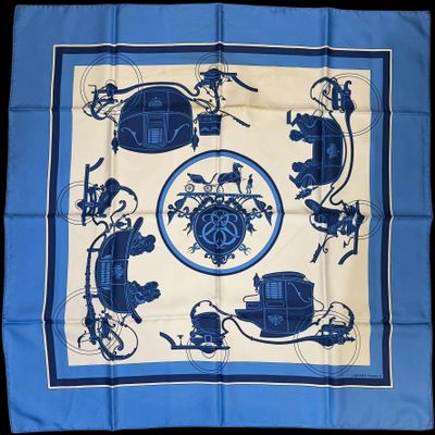 a blue and white square scarf with a picture of a horse drawn carriage