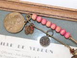 a picture of a picture of a brooch with a coin