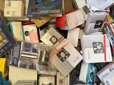a cardboard box full of electronic devices and other items