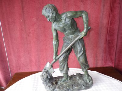 a statue of a man with a dog on a table