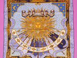 a square scarf with a sun and stars on it