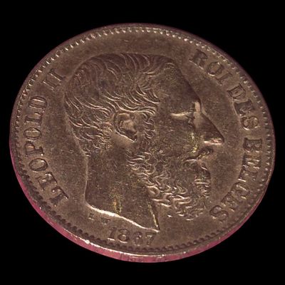 an old coin with a woman ' s face on it