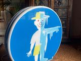 a blue sign with a picture of a man on it