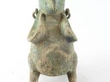 an image of a statue of a frog with a bird on it ' s back