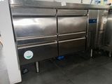 two stainless steel ovens that are in a kitchen