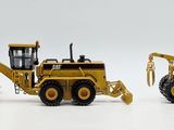 two toy construction vehicles that are sitting side by side
