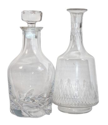 pair of clear glass decanters on a white background