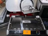 an image of a kitchen with a pizza cutter on the counter