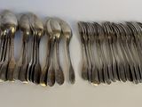 a lot of spoons that are sitting on a table