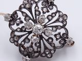 an image of a diamond flower broochle on a white background