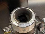 a camera lens sitting on top of a metal object