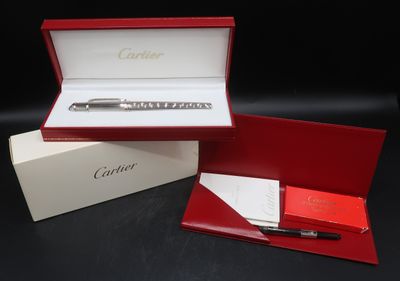 an image of a red box with a pen inside of it