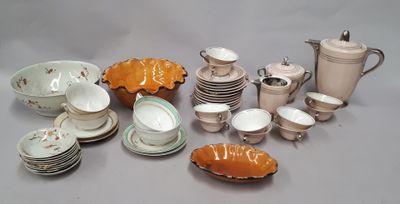 many different types of dishes and cups on the table