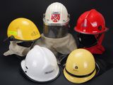 several different types of hard hats are lined up on a black background