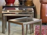 three tables that are sitting on a rug in a room