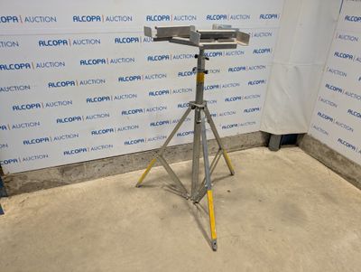 an image of a camera on a tripod in front of a wall