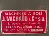 a red sign that is on the side of a machine