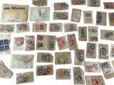 a lot of stamps and stamps on a white surface