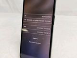 the back of a black phone with a display on the screen