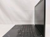 a black laptop computer sitting on a white surface