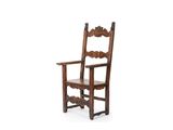 an old wooden chair sitting on top of a white surface