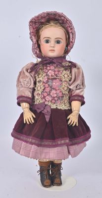 a doll that is wearing a purple dress and hat