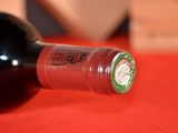 a bottle of wine that is sitting on a table