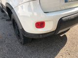 a white car parked on the side of the road