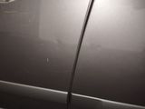 a close up of a car door with a sticker on it