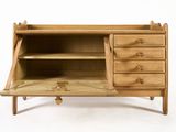 a wooden cabinet with drawers and a shelf on it