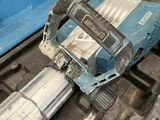 a blue tool box with a hammer and a drill on it
