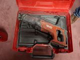 a red tool box with a hammer and a tool in it